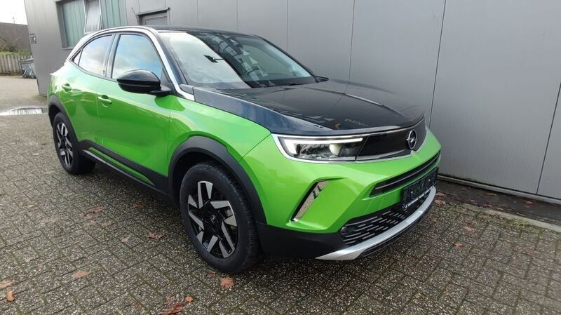 Grün Gebraucht 2021 Opel Mokka-e Elegance SUV | 20.890 € (Teuer) - Bild 1/4
