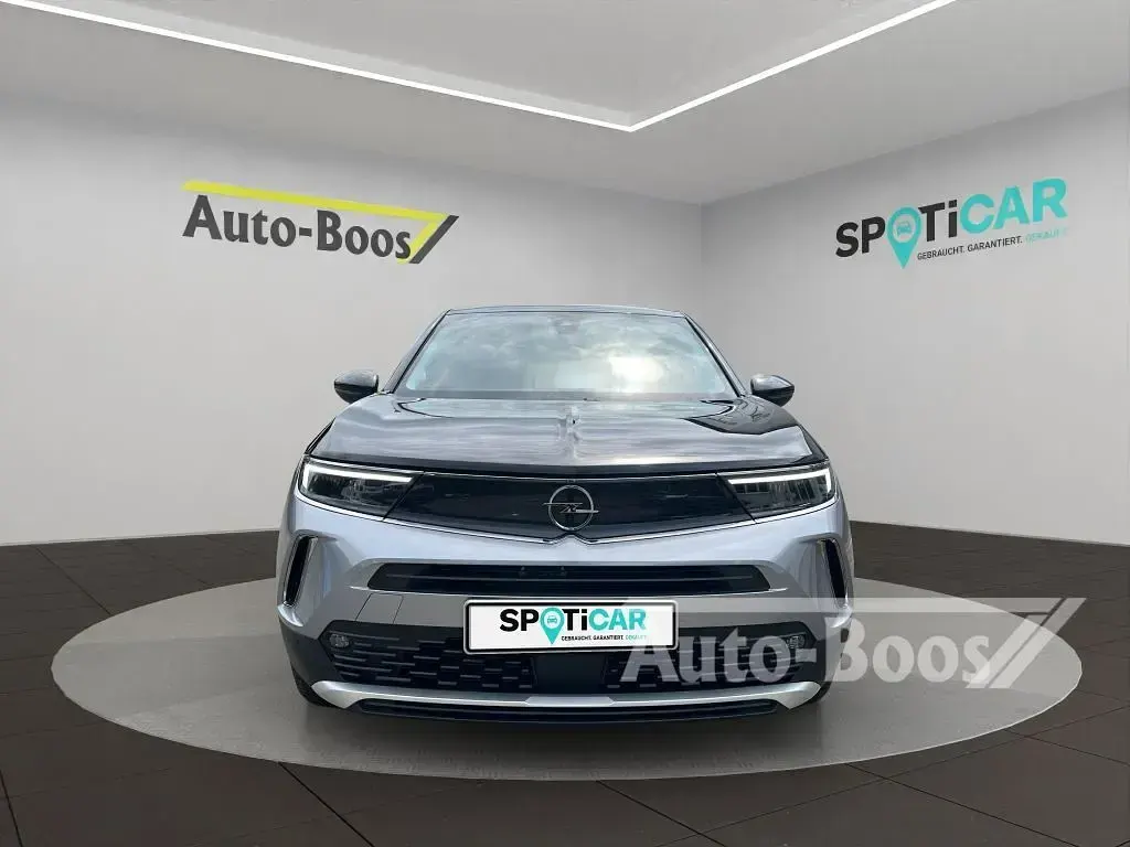 Gebraucht Opel Mokka-e Elegance 100 kW (136 PS) 2021 Quarz silber metallic SUV