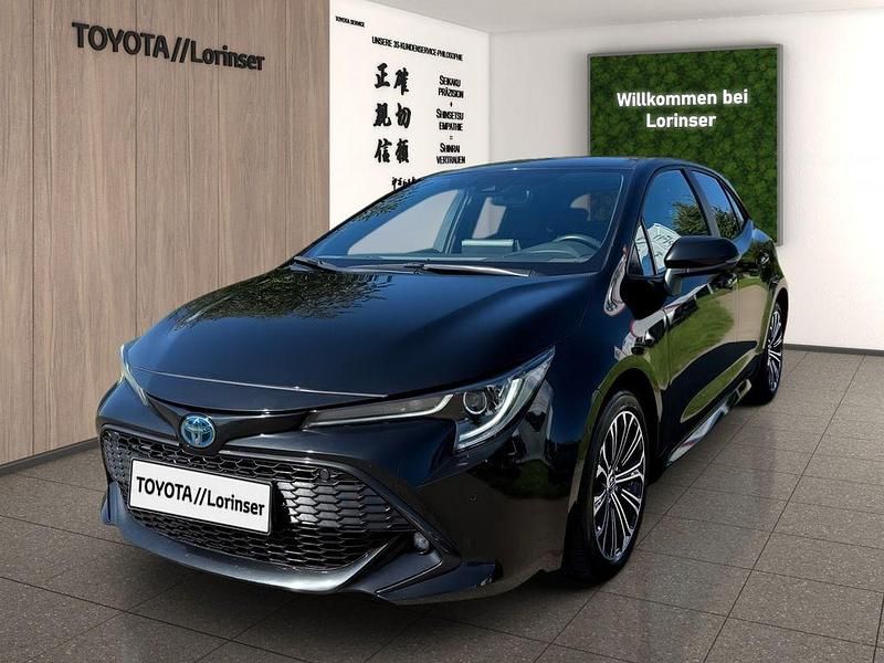 Black mica / ink Gebraucht 2022 Toyota Corolla Team Limousine | 23.990 € (Fairer Preis) - Bild 1/4