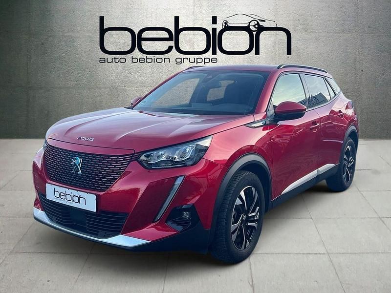 Elixirrot Gebraucht 2021 Peugeot e-2008 Allure SUV | 16.480 € (Guter Preis) - Bild 1/4