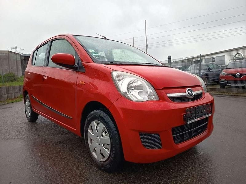 Gebraucht Daihatsu Cuore 58 PS (42 kW) 2011 Rot Kleinwagen