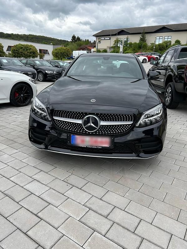 Schwarz Gebraucht 2021 Mercedes C300e AMG line Limousine | 29.999 € - Bild 1/4