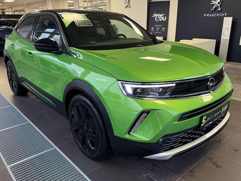 Gebraucht Opel Mokka Ultimate 131 PS (96 kW) 2023 Matcha green metallic SUV