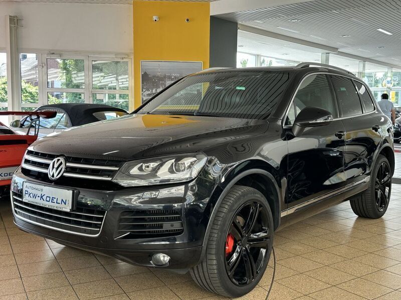 Deep black perleffekt (metallic) Gebraucht 2014 VW Touareg SUV | 23.950 € - Bild 1/4