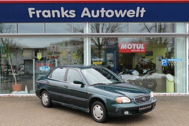 Grün metallic Gebraucht 2002 Suzuki Baleno GL Limousine | 590 € - Bild 1/4