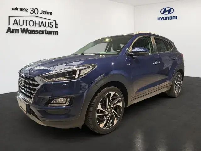 Stellar blue / met Gebraucht 2019 Hyundai Tucson Premium SUV | 23.999 € (Teuer) - Bild 1/4