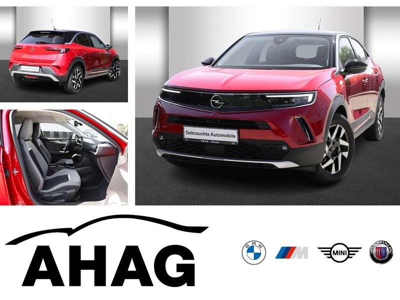 Power rot/kosmos rot Gebraucht 2022 Opel Mokka-e Elegance SUV | 18.490 € (Guter Preis) - Bild 1/4