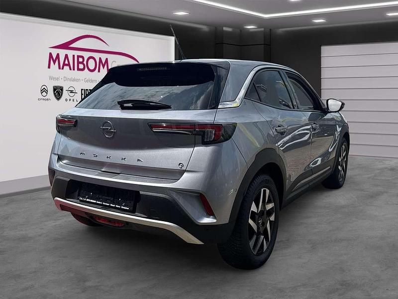 Gebraucht Opel Mokka-e Elegance 100 kW (136 PS) 2021 Kontrast grau/quarz silber SUV