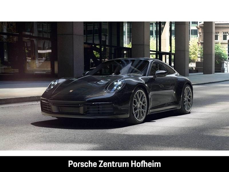 Tiefschwarzmetallic Gebraucht 2023 Porsche 911 Carrera Coupé | 124.490 € (Fairer Preis) - Bild 1/4