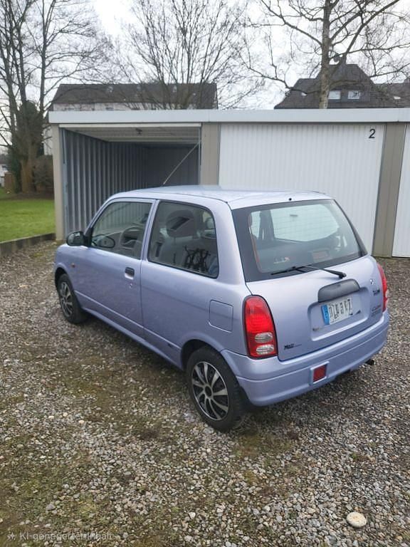 Gebraucht Daihatsu Cuore 56 PS (41 kW) 2003 Violet Kleinwagen