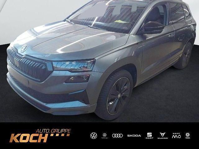 Grau Gebraucht 2024 Skoda Karoq SportLine SUV | 37.930 € (Teuer) - Bild 1/2