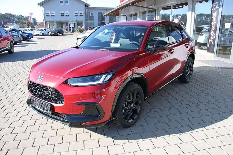 Radiant red metallic Neu 2025 Honda ZR-V Hybrid SUV | 38.900 € (Fairer Preis) - Bild 1/4
