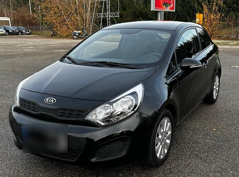 Schwarz Gebraucht 2012 Kia Rio Kleinwagen | 5.499 € - Bild 1/4