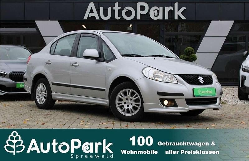 Silber Gebraucht 2010 Suzuki SX4 Comfort Limousine | 5.690 € (Fairer Preis) - Bild 1/3