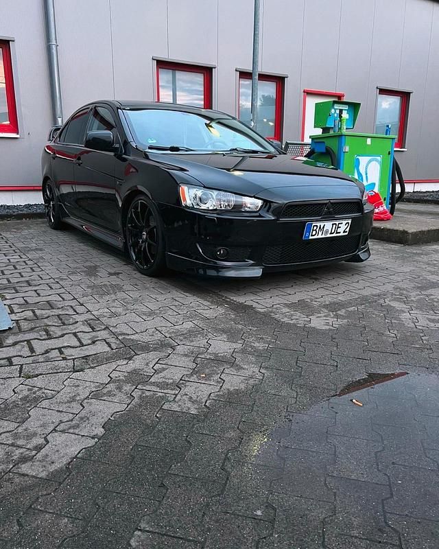 Schwarz Gebraucht 2014 Mitsubishi Lancer Limousine | 13.500 € - Bild 1/4