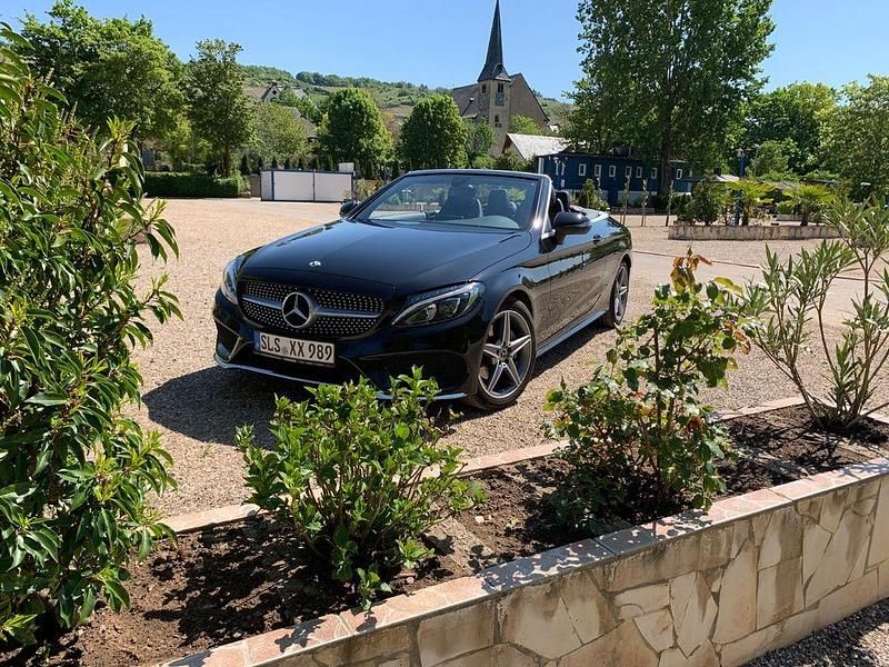 Schwarz Gebraucht 2018 Mercedes C180 AMG line Cabrio | 26.800 € (Fairer Preis) - Bild 1/4