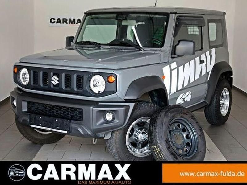 Grau (metallic) Gebraucht 2022 Suzuki Jimny Comfort SUV | 27.900 € - Bild 1/4
