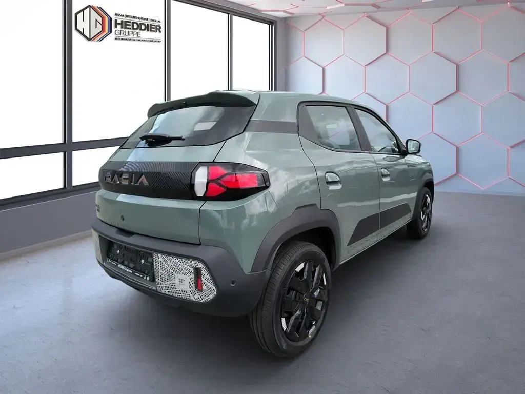 Gebraucht Dacia Spring Extreme 47 kW (65 PS) 2025 Olivgrün Kleinwagen