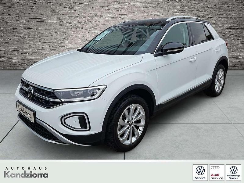Pure whiteschwarz (weiß) Gebraucht 2023 VW T-Roc Style SUV | 27.900 € (Fairer Preis) - Bild 1/4