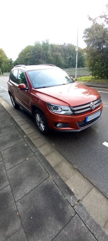 Rot Gebraucht 2012 VW Tiguan Sportline SUV | 8.550 € (Superpreis) - Bild 1/4