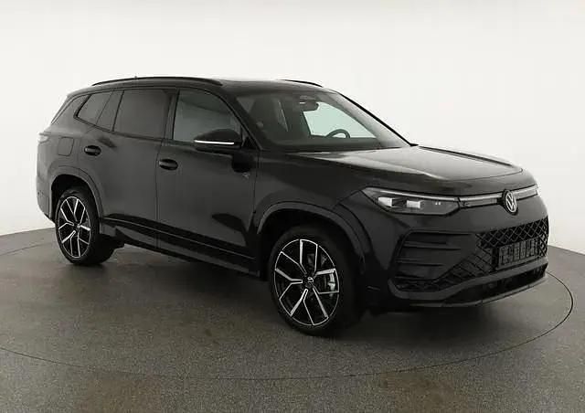 Grenadill schwarz metallic Neu 2025 VW Tayron R-line SUV | 57.495 € (Guter Preis) - Bild 1/3