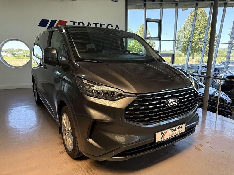 Grau Gebraucht 2024 Ford Tourneo Custom Titanium Van / Kleinbus | 50.890 € (Teuer) - Bild 1/4