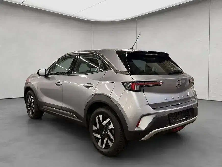 Gebraucht Opel Mokka-e Elegance 100 kW (136 PS) 2023 Kontrast grau metallic SUV