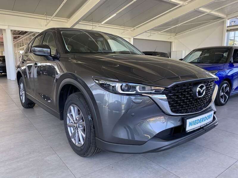 Machine grey (metallic) Gebraucht 2024 Mazda CX-5 Center-Line SUV | 30.800 € (Fairer Preis) - Bild 1/4