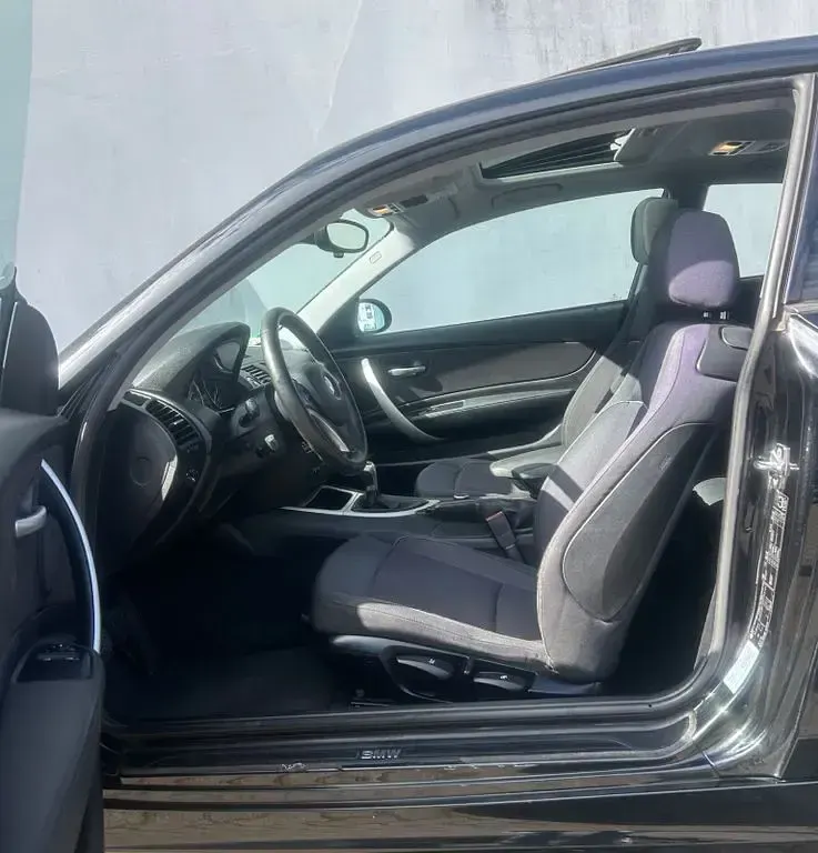 Gebraucht BMW 116 122 PS (89 kW) 2009 Schwarz Kleinwagen