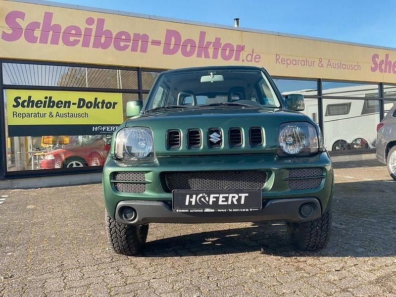 Grün Gebraucht 2009 Suzuki Jimny Club SUV | 8.900 € (Fairer Preis) - Bild 1/4
