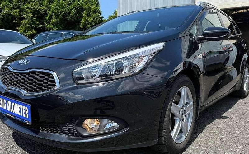 (1k) black pearl Gebraucht 2014 Kia Ceed Sportswagon Edition 7 Kombi | 8.490 € (Superpreis) - Bild 1/4