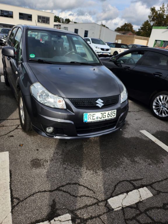 Grau Gebraucht 2011 Suzuki SX4 City Limousine | 6.000 € (Fairer Preis) - Bild 1/4
