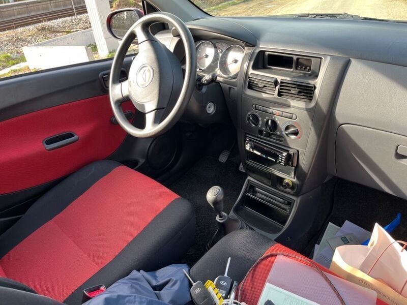 Gebraucht Daihatsu Cuore 58 PS (42 kW) 2007 Rot Kleinwagen