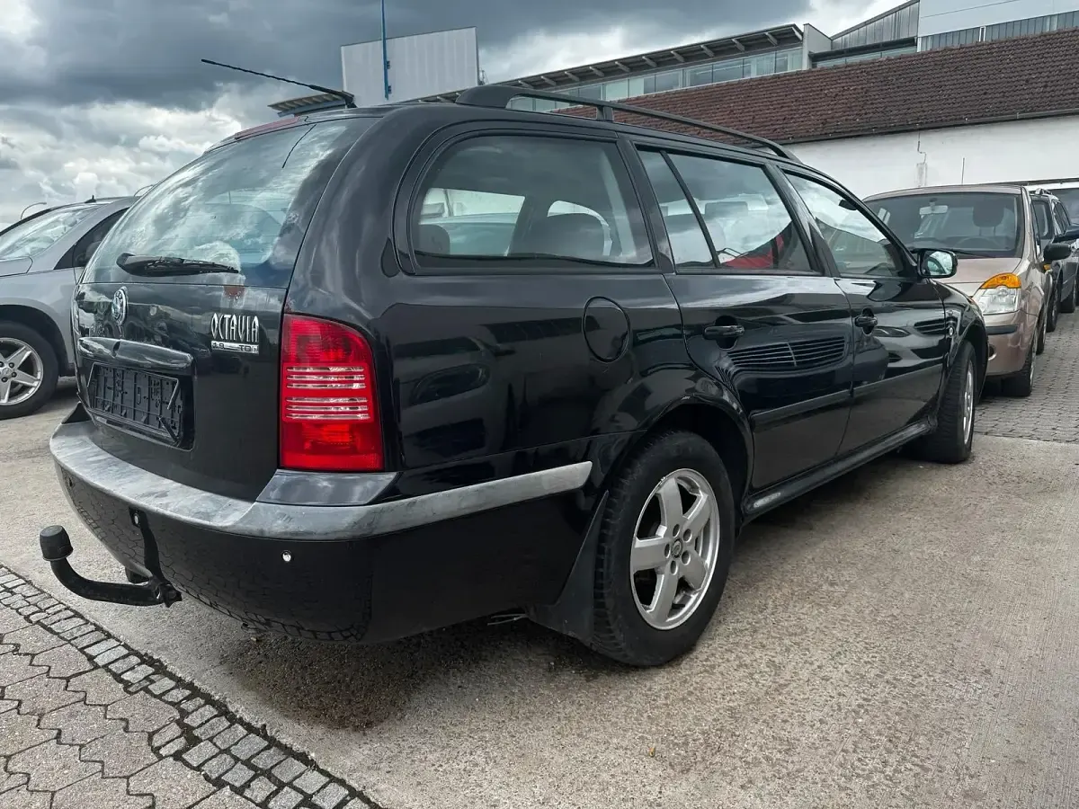 Używany Skoda Octavia 110 KM (80 kW) 2003 Czarny Kombi