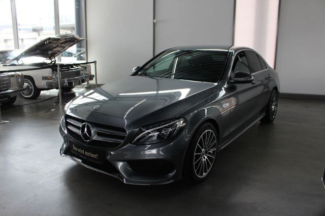 Grau , selenitgrau metallic Gebraucht 2018 Mercedes C180 AMG Limousine | 28.690 € (Teuer) - Bild 1/4