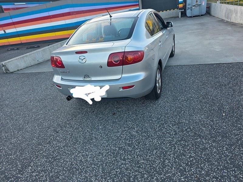 Second-hand Mazda 3 105 CP (77 kW) 2004 Argintiu Berlinǎ
