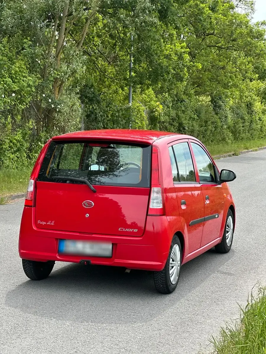Gebraucht Daihatsu Cuore 60 PS (44 kW) 2004 Rot Kleinwagen