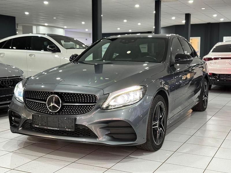 Grau Gebraucht 2020 Mercedes C300e AMG line Limousine | 22.490 € (Guter Preis) - Bild 1/4