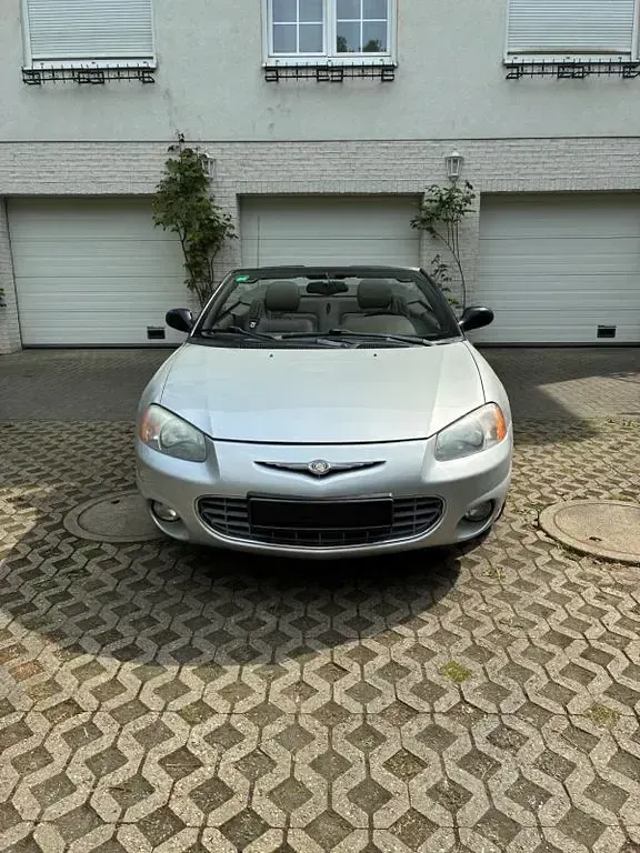 Second-hand Chrysler Sebring Cabriolet 203 CP (149 kW) 2003 Argintiu Cabrio