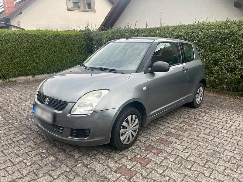 Grau Gebraucht 2007 Suzuki Swift Kleinwagen | 300 € (Superpreis) - Bild 1/4