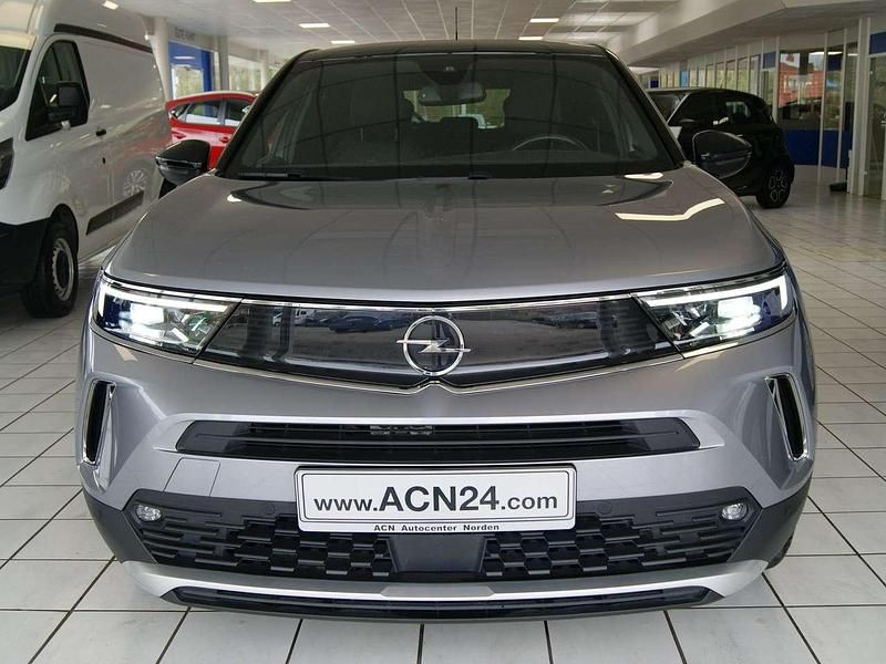 Gebraucht Opel Mokka-e Ultimate 100 kW (136 PS) 2021 Kontrast grau/quarz silber SUV