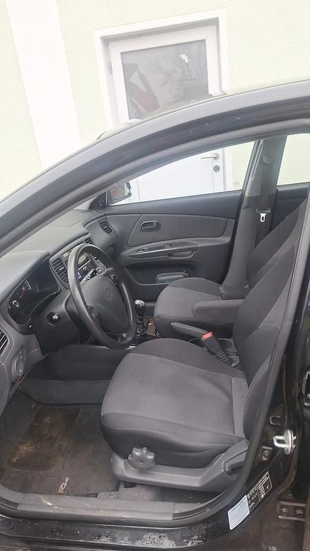 Gebraucht Kia Rio 97 PS (71 kW) 2009 Schwarz Kleinwagen