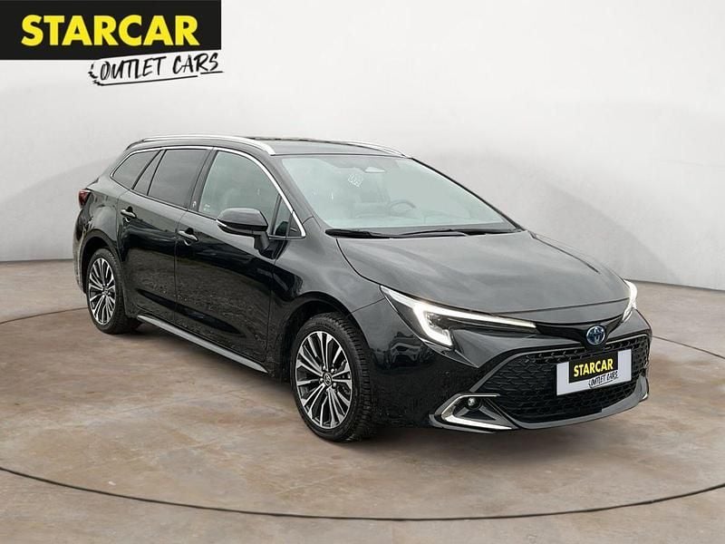 Black mica / ink Gebraucht 2023 Toyota Corolla Hybrid Team Kombi | 29.570 € (Fairer Preis) - Bild 1/4