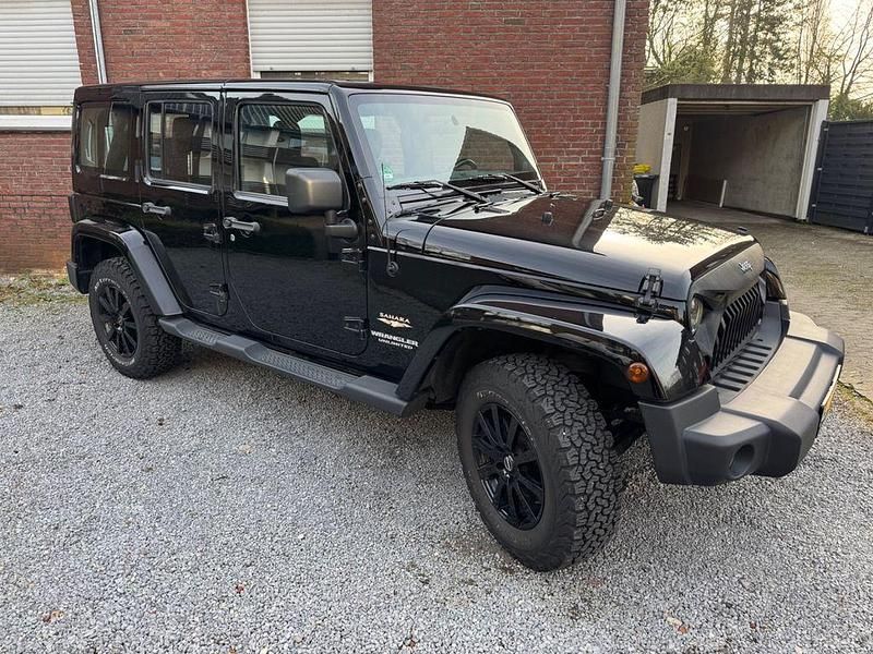 Schwarz Gebraucht 2012 Jeep Wrangler Unlimited Sahara SUV | 18.900 € (Superpreis) - Bild 1/4