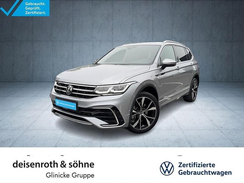 Pyritsilber metallic Gebraucht 2024 VW Tiguan Allspace R-line SUV | 48.880 € (Teuer) - Bild 1/4