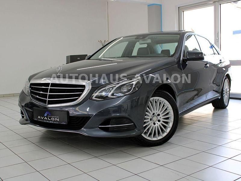 Tenoritgrau metallic Gebraucht 2015 Mercedes E400 Limousine | 27.980 € (Fairer Preis) - Bild 1/4