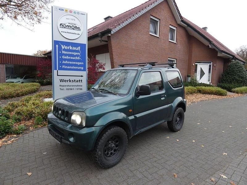 Gruen (metallic) Gebraucht 2002 Suzuki Jimny SUV | 3.950 € (Superpreis) - Bild 1/4