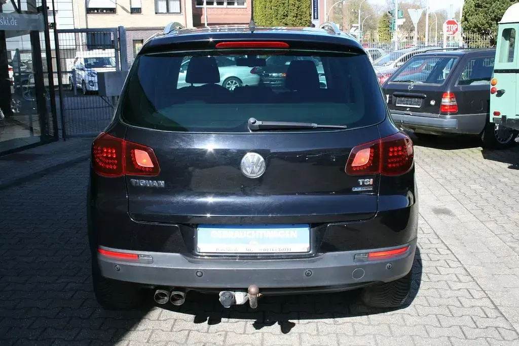 Gebraucht VW Tiguan Team 122 PS (89 kW) 2011 Schwarz SUV