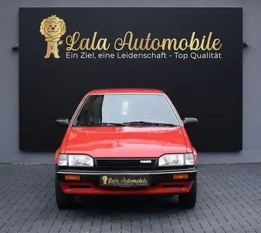 Gebraucht Mazda 323 75 PS (55 kW) 1988 Rot Kleinwagen