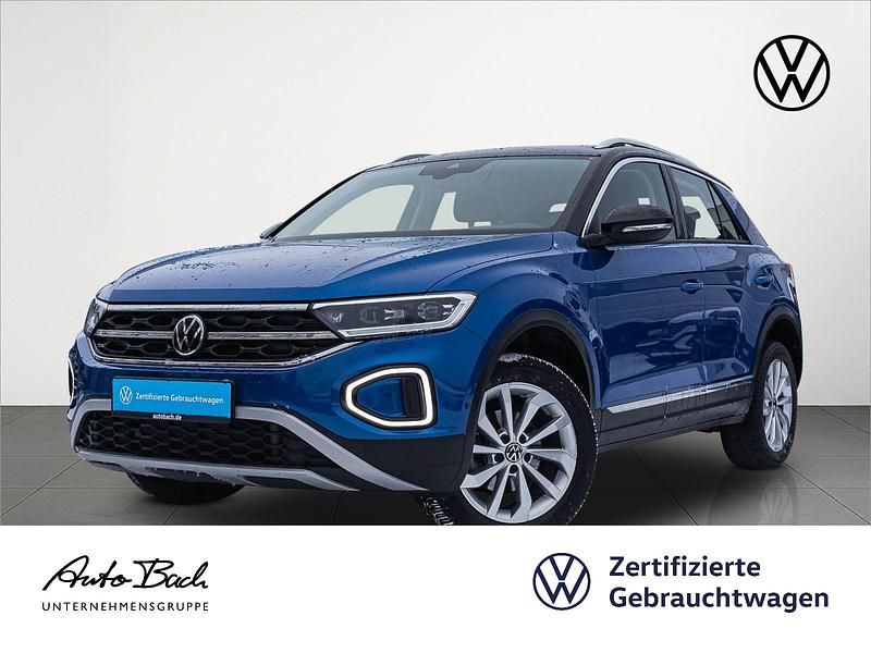 Ravennablau metallic/schwarz Gebraucht 2022 VW T-Roc Style SUV | 24.940 € (Guter Preis) - Bild 1/4